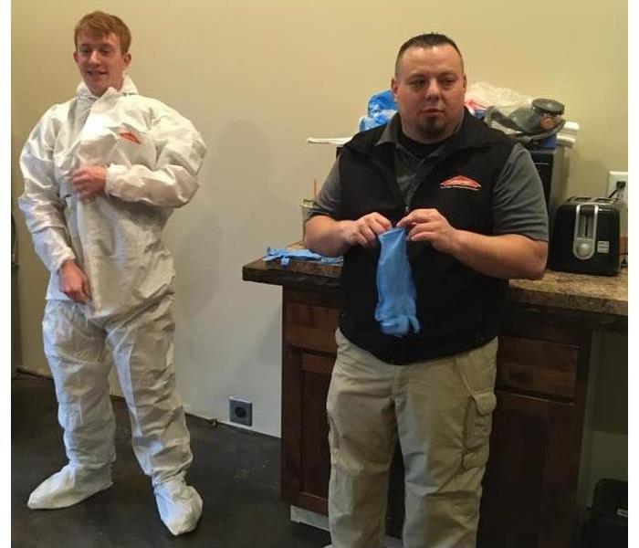 Axel and Daniel from SERVPRO of Benton/Linn county are demostration how to use Personal Protective Equipment.